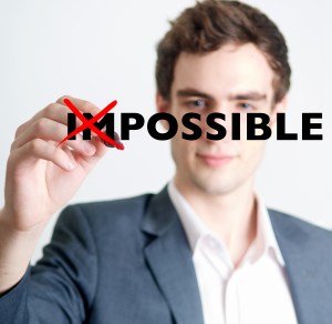 man crossing out impossible concept